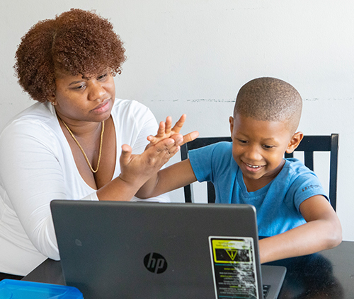 mom and son studying and counting with hands