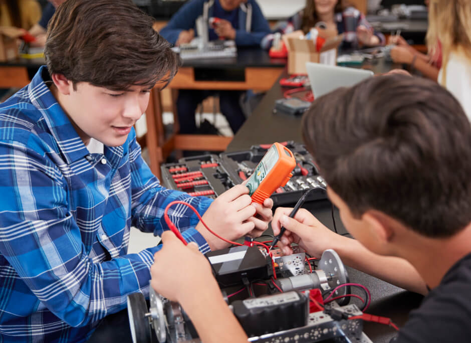 Students working with tools